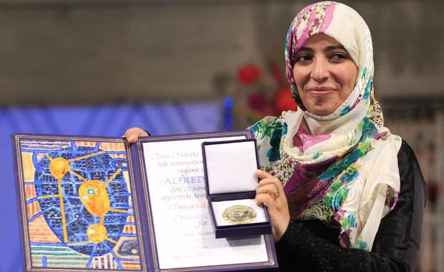 Йеменская журналистка, правозащитница, политик. В 2005 году стала одним из основателей организации «Женская журналистика без цепей», в 2011 году приобрела международную известность как лицо восстания в Йемене. Известная на родине как «мать революции» и «железная женщина», стала первой арабской женщиной и второй мусульманкой, получившей Нобелевскую премию.