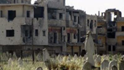 Поездка по некоторым районам Хомса напоминает путешествие по городу-призраку.